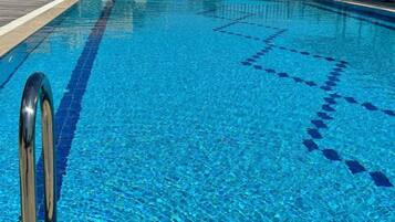 Relax by the pool with a refreshing swim or lounge on one of the available chairs.