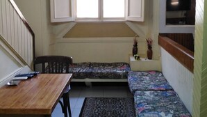 A dormitory-style room with bunk beds, a desk, and a window. - Panorama Palace hotel  (Cairo)