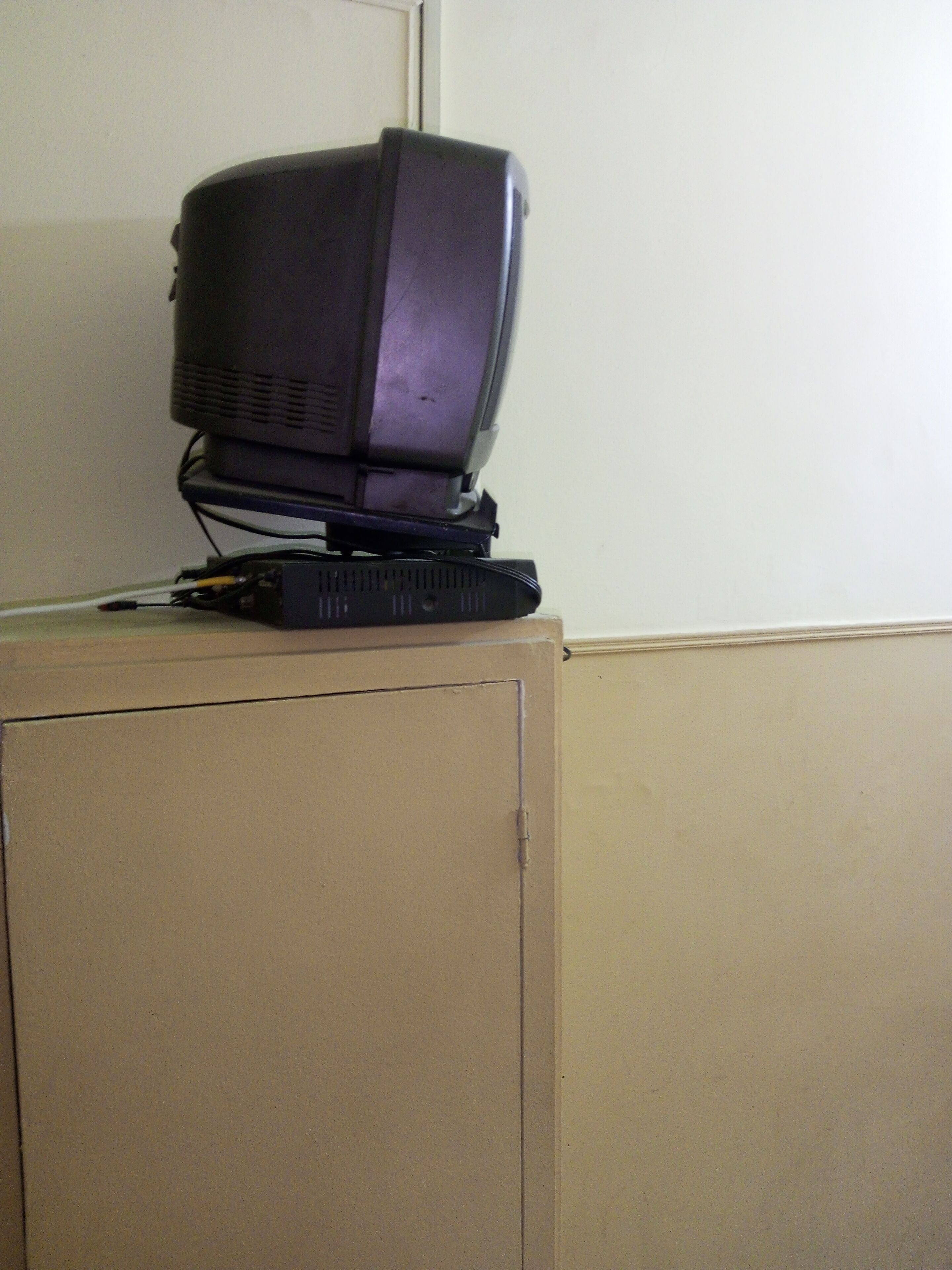 A television on a cabinet.