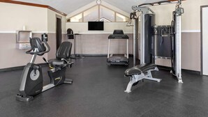 A gym with stationary bikes, a treadmill, and weightlifting equipment. - Baymont Inn And Suites By Wyndham Farmington Mo (Farmington)