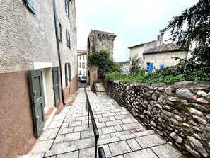 Stroll through a charming historic town, surrounded by traditional stone buildings and narrow cobblestone alleys.
