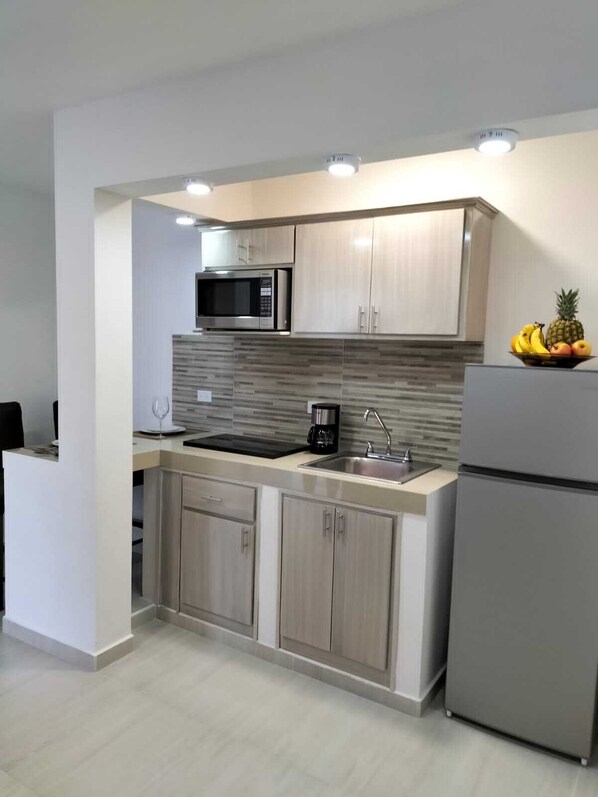 Fridge, microwave, stovetop, coffee/tea maker