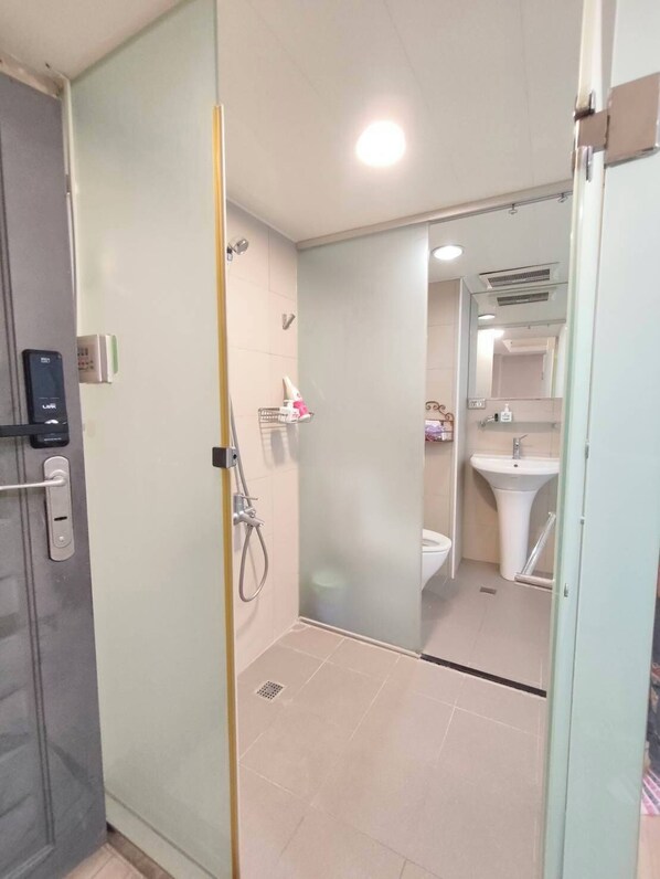 Shower, hair dryer, towels, soap