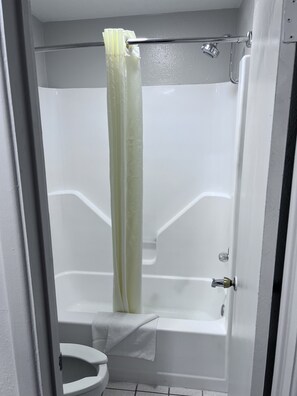 Deep-soaking bathtub, rainfall showerhead, free toiletries, hair dryer
