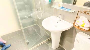 Shower, hair dryer, towels, soap