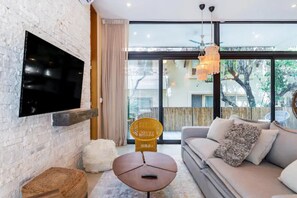 Family Apartment | Living area | 50-inch Smart TV with digital channels, Netflix, streaming services