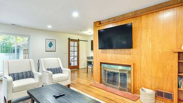TV, fireplace, books