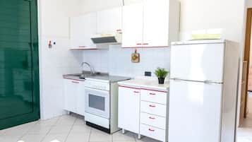 Fridge, oven, dining tables