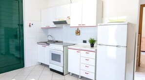 Fridge, oven, dining tables