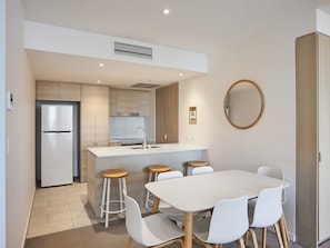 Enjoy meals in the kitchen with a central island and adjacent dining area.