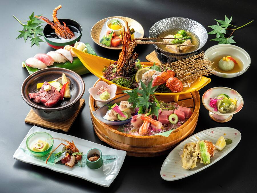 A variety of sushi and sashimi dishes arranged on a table.