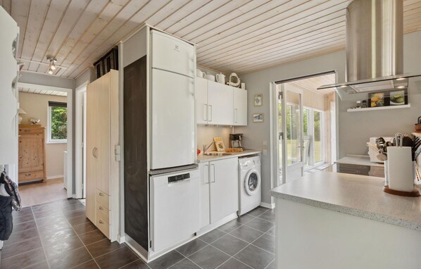 Fridge, stovetop, dishwasher, coffee/tea maker