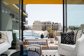 Comfort Apartment | Living area | 65-inch Smart TV with digital channels, TV - Beach House Style Condo & Pool (Tel Aviv)