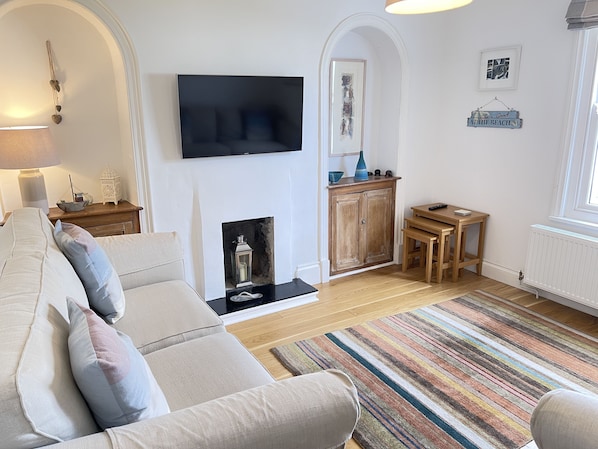TV, fireplace, books