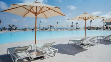 Indoor pool, 7 outdoor pools, pool umbrellas, lifeguards on site