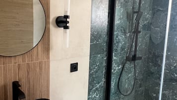 Shower, hair dryer, towels, toilet paper