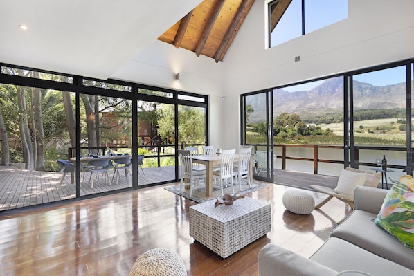 Deluxe House | Living area | 42-inch LED TV with satellite channels, TV - Lake View House (Cape Town)