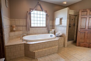 Jetted tub, hair dryer, towels, soap