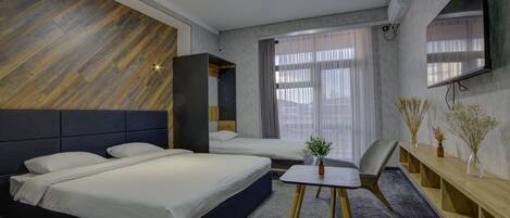 Comfort Triple Room | Minibar, desk, laptop workspace, free WiFi
