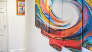 A modern art gallery with abstract paintings. - The Studio at Malt Kiln Cottage (Grizebeck, near Kirkby-in-Furness)