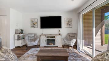 Condo, 1 King Bed with Sofa bed, Patio, Garden View (3 Bears Hideaway ) | Living area | 50-inch flat-screen TV with digital channels, fireplace