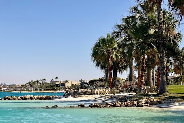 Private beach nearby, white sand, beach shuttle, beach umbrellas