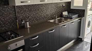 Fridge, cleaning supplies, paper towels