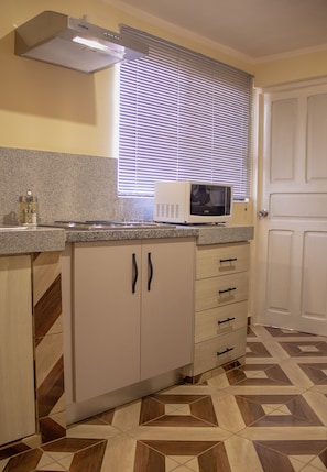 Fridge, microwave, coffee/tea maker, toaster
