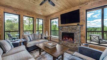 Cabin, Multiple Beds, Hot Tub, Mountain View (Lion's Landing) | Living area | 55-inch flat-screen TV with digital channels, TV, fireplace