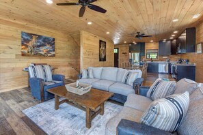 Cabin, Multiple Beds, Hot Tub, Mountain View (Lion's Landing) | Living area | 55-inch flat-screen TV with digital channels, TV, fireplace - Pet Friendly Cabin Hot Tub, Games & Fishing Pond (Sevierville)