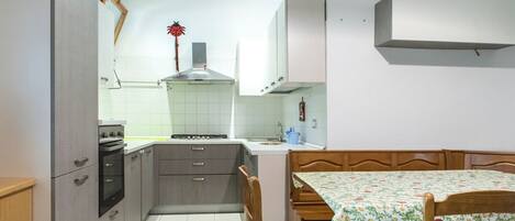 Fridge, oven, dining tables