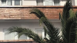 A building with a sign that reads 'OF SUIT BY KADIOGLU'. - Avşa apart otel (Marmara)