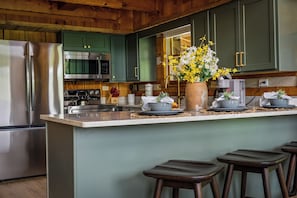 Coffee/tea maker, fridge, microwave, oven