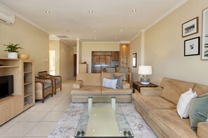 Apartment (2 Bedrooms) | Living area | 42-inch LED TV with satellite channels, TV - Summer Place 9 (Cape Town)