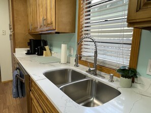 Fridge, microwave, oven, stovetop - Gulfport Beach Getaway - Blocks to beach and casino, large yard & entertaintment (Gulfport)