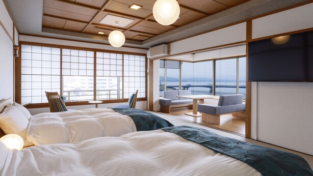 A hotel room with a large window, a sofa, a table, and two beds. - Ohashikan (Matsue)