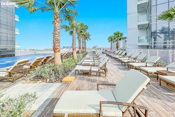 Outdoor pool - bnbme | Damac Hills Carson Tower | STUDIO (Dubai)