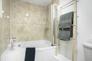 Apartment, 1 King Bed with Sofa bed | Bathroom | Combined shower/tub, deep soaking tub, hair dryer, towels