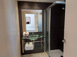 Shower, hair dryer, towels, toilet paper