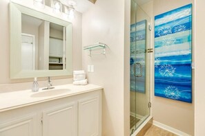 Shower, hair dryer, towels, shampoo