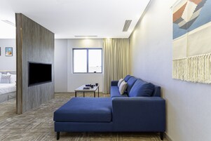 Junior Suite | Living area | 43-inch LED TV with satellite channels, TV