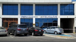 A hotel with a modern facade, multiple parking spaces, and a clear blue sky. - Westin Mark Hotel (Madinah)