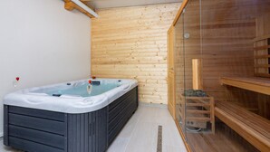 A spa room with a hot tub, wooden walls, and a sauna area. - Villa Antani with heated pool, sauna and jacuzzi (Crikvenica)