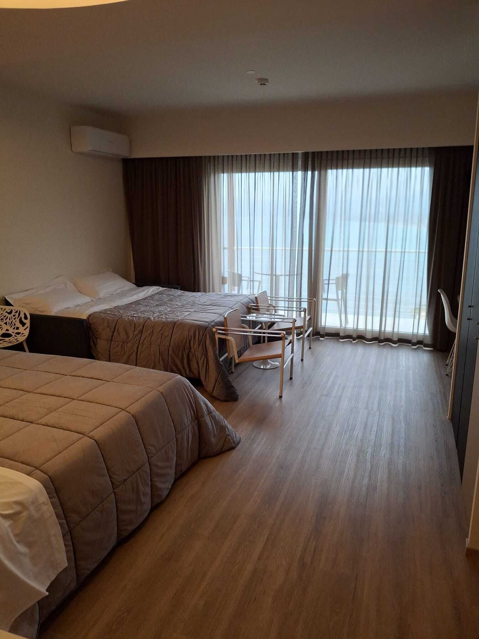 Junior Triple Room, 1 King Bed with Sofa bed, Non Smoking, Sea View | Minibar, in-room safe, individually decorated, individually furnished