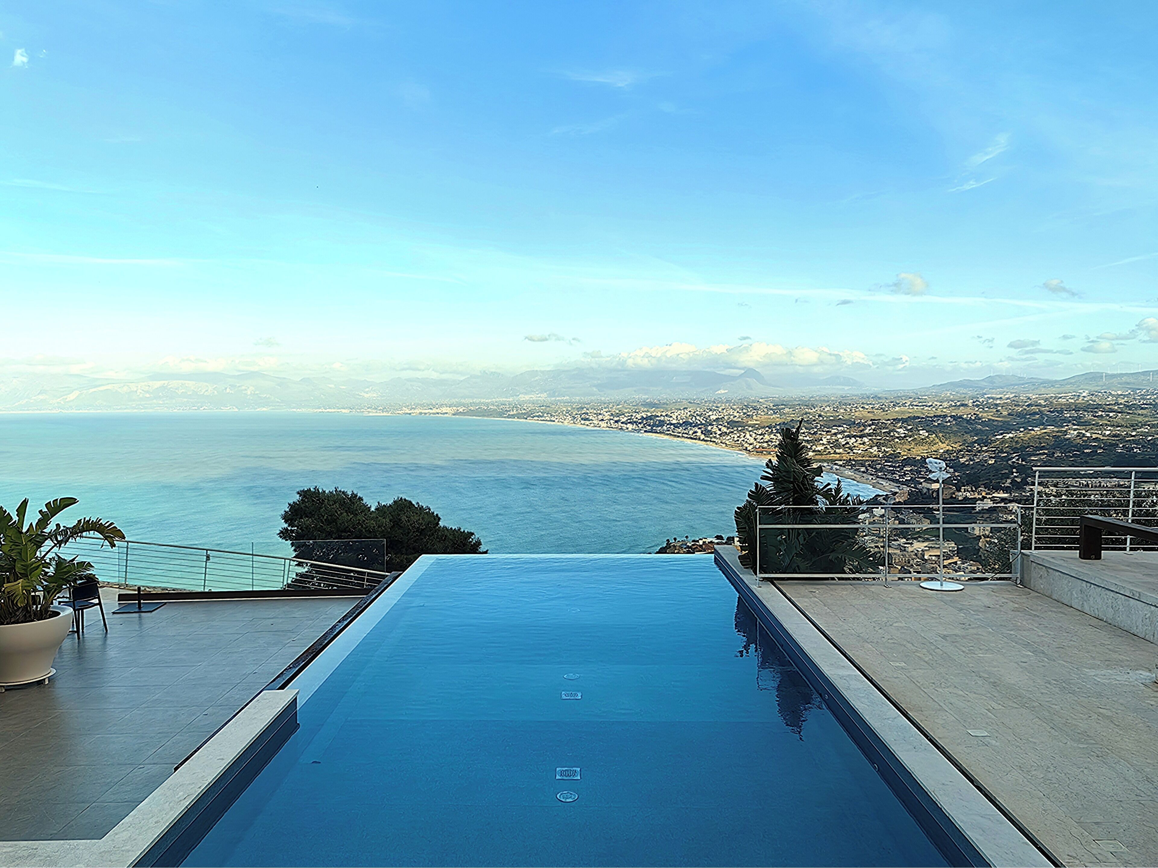 Seasonal outdoor pool, open 6:00 AM to 6:00 PM, pool umbrellas