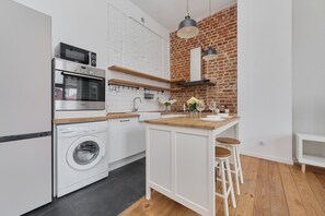 Apartment, 1 Bedroom, Balcony | Private kitchen | Microwave, dishwasher, cookware/dishes/utensils, dining tables - Spacious Apartment Saperów by Renters (Wroclaw)