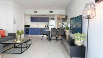 King Suite with Private Pool (1) | Living area | 34-inch flat-screen TV with cable channels, TV