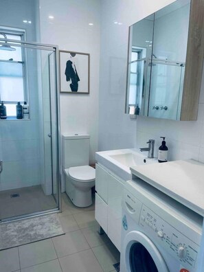 Shower, hair dryer, towels, soap