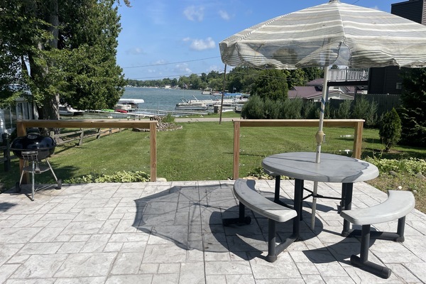 Outdoor patio with large yard and firepit
