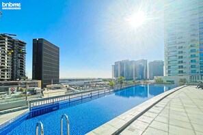 Outdoor pool - bnbme | U Bora Towers | 3 + Maids (Dubai)